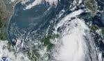 Dans cette image satellite du lundi 28 août 2023, la tempête tropicale « Idalia » se déplace entre la péninsule mexicaine du Yucatán, à gauche, et Cuba, à droite.
